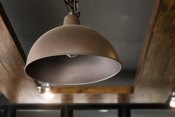 Vintage interior lighting lamp in coffee shop.
