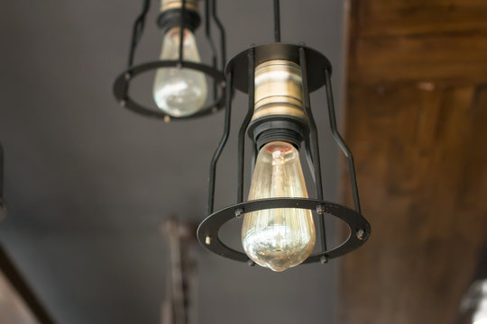 Vintage interior lighting lamp in coffee shop.