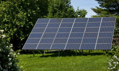 Backyard Solar Panels Generate Electricity Cutting Homeowner Carbon Foot Print