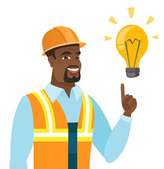 African-american builder pointing at light bulb.