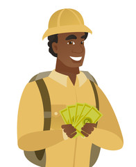 Young african-american traveler holding money.