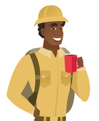 African-american traveler holding cup of coffee.