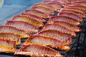 Meat ribs of pig roasting on barbecue