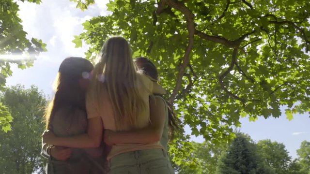 Group Of Girls Run Over To Greet Their Friend, They All Hug (Slow Motion)