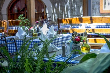 Set tables with flowers in a Mediterranean restaurant
