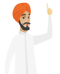 Businessman with open mouth pointing finger up.