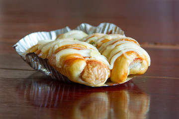 Sausage and mayonnaise  sauce on wooden table