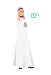 Muslim businessman holding a mobile phone.