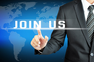 Businessman hand touching JOIN US sign on virtual screen