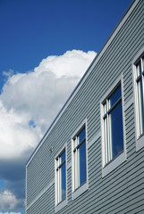  close up on office building exterior with white cloud