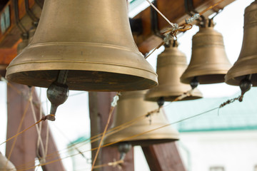 bronze bells on  beam in belfry closeup