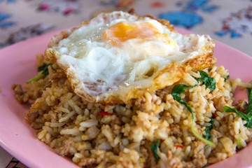 Thai stir-fried chicken and basil served with rice and fried egg