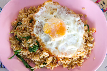 Thai stir-fried chicken and basil served with rice and fried egg