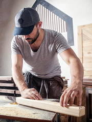 man  equals a wooden bar milling machine