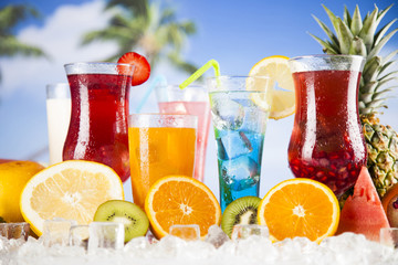 Summer drink, palm branch and Fresh tropical fruits