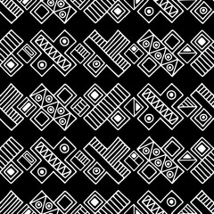 Fototapeta premium Seamless vector pattern. Black and white geometrical background with hand drawn decorative tribal elements. Print with ethnic, folk, traditional motifs. Graphic vector illustration.