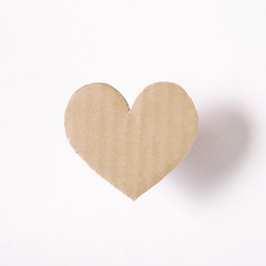 Heart shaped paper on white background