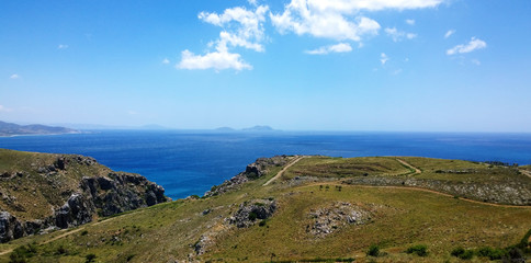 Fototapeta na wymiar The sea and beach in clear Sunny weather. The island of Crete, the Libyan sea near Preveli