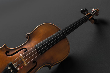 Fototapeta premium Old violin on a black background