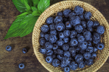 Fresh blueberry with leaf on white background