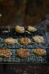 Fry the cutlets on an open fire on the grill - bbq (burgers)