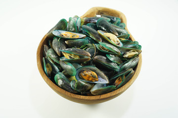 Stream mussels seafood top view in wooden bowl isolated white background