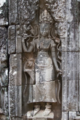 showing dancing Hindu goddesses at Bayon temple, Cambodia.