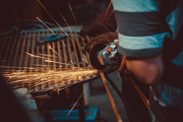 Sparks during cutting of metal angle grinder. Close-up saw sawing a steel