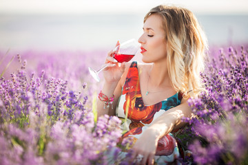 Portrait of beautiful sexy girl sitting in lavender field