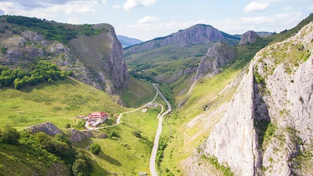Cloud shades moving fast over super gorges through mountains. Time lapse video.