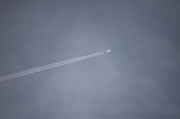 The plane is flying in the dark stormy sky