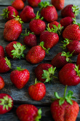 Strawberries on old wooden background