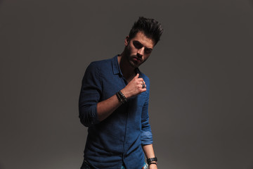 unshaved casual man posing in studio