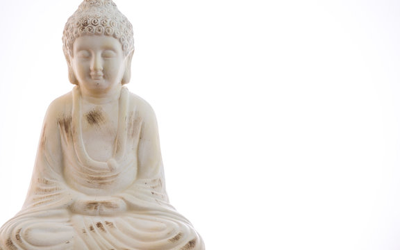 Ceramic Buddha statue with plain white background & copy space for text.