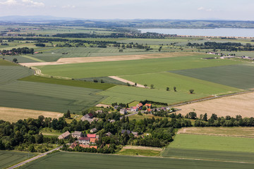 Fototapeta na wymiar aerial view of the village and harvest fields