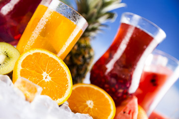 Summer drink, palm branch and Fresh tropical fruits