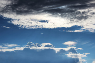Fototapeta na wymiar white clouds against the blue sky on a sunny summer day.