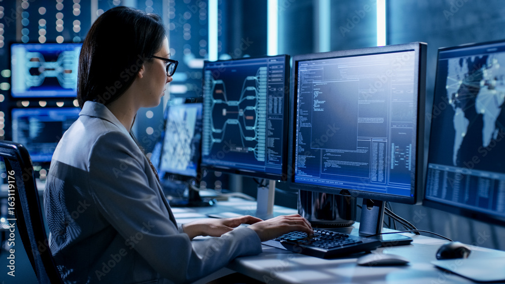 Poster Female System Engineer Controls Operational Proceedings. In the Background Working Monitors Show Various Information.