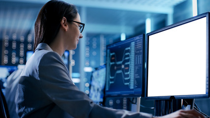 Close up Shot of Female Engineer Controller Observes Working of the System. She Works With White...
