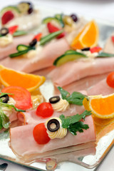 appetizer set with ham and fruits