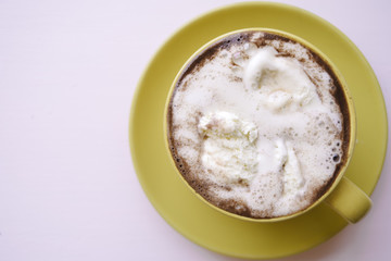 Ice cream and coffee in yellow cup