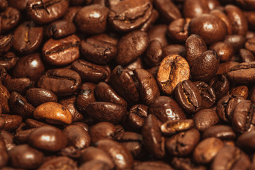 Dark many roasted coffee beans texture background