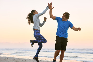 Couple High Five And Celebrate After Work Out