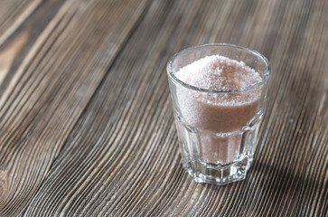 Glass of pink sea salt