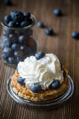 Waffle with whipped cream and blueberries