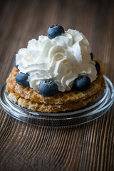 Waffle with whipped cream and blueberries