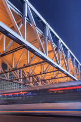 Pedestrian bridge with traffic in motion blur at night, Beijing center, China