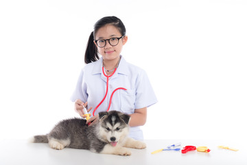 Asian child playing veterinarian