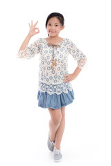Cute asian girl in summer dress showing ok sign