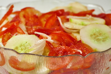 Salad with red tomato and gherkins - close up